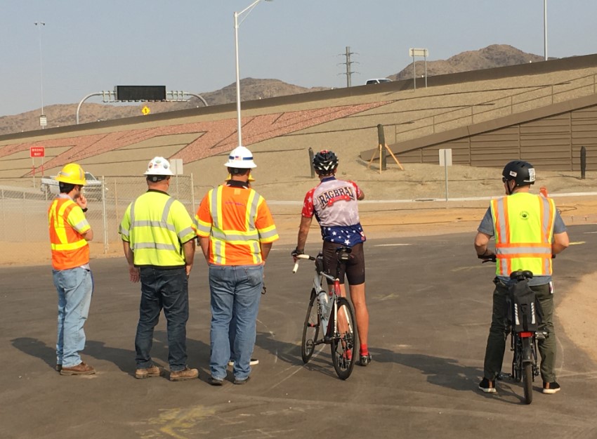 ADOT workers talk with a bicyclist
