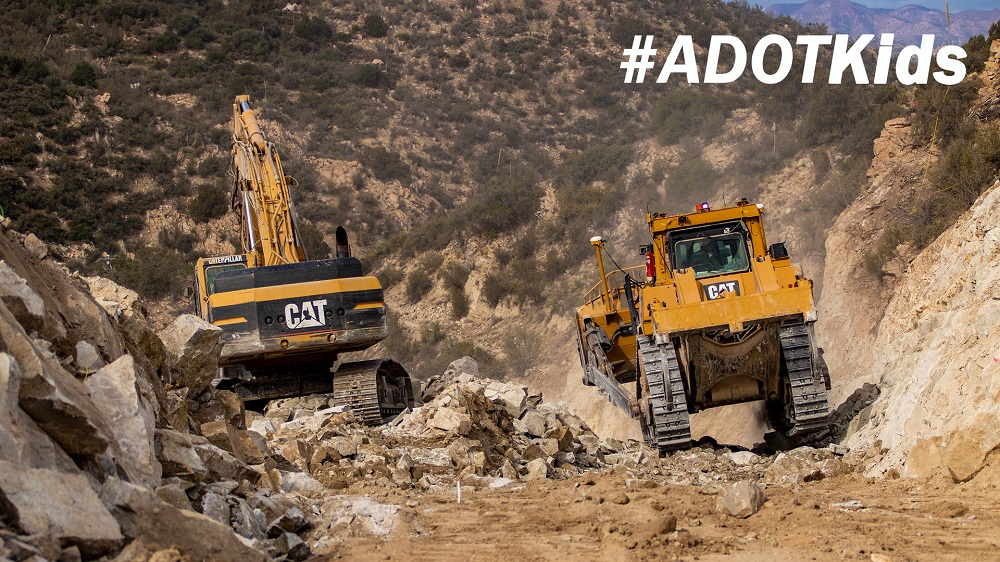 Adot kids image road construction heavy equipment moving bouders.