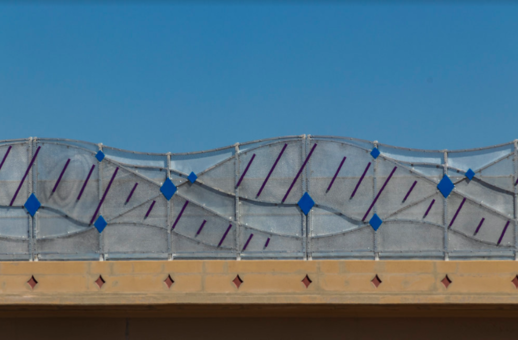 Blue diamond artwork on bridge