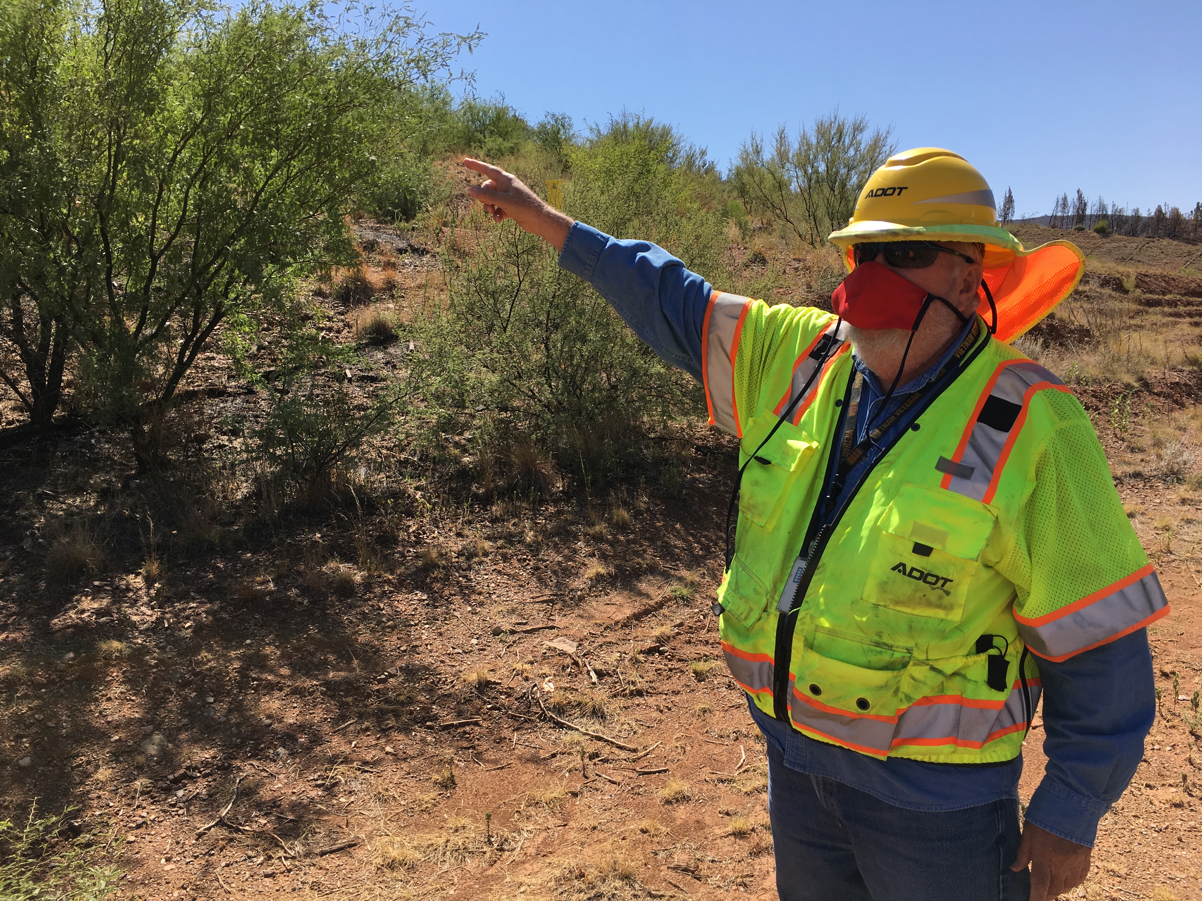 ADOT Geologist Studies the earth rocks on-site
