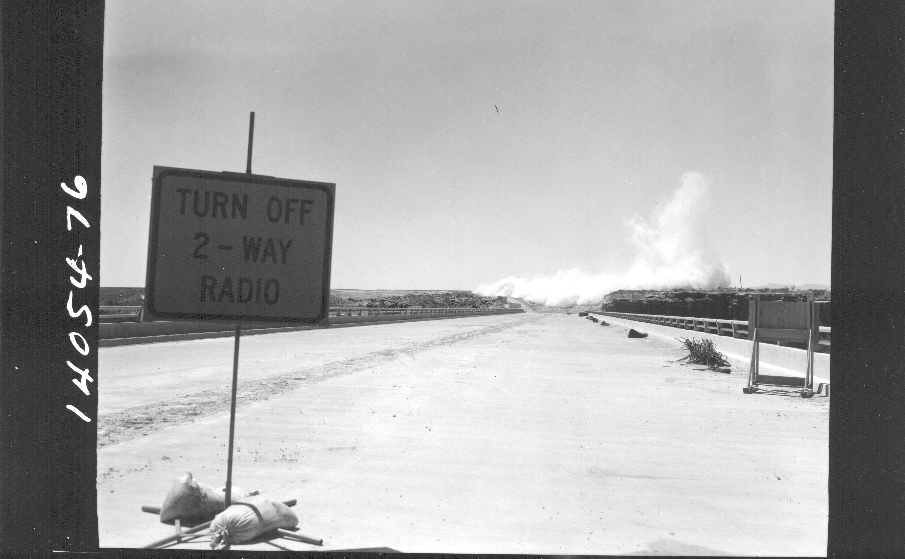 Black and white image of a sign that reads "Turn off 2-way radio"