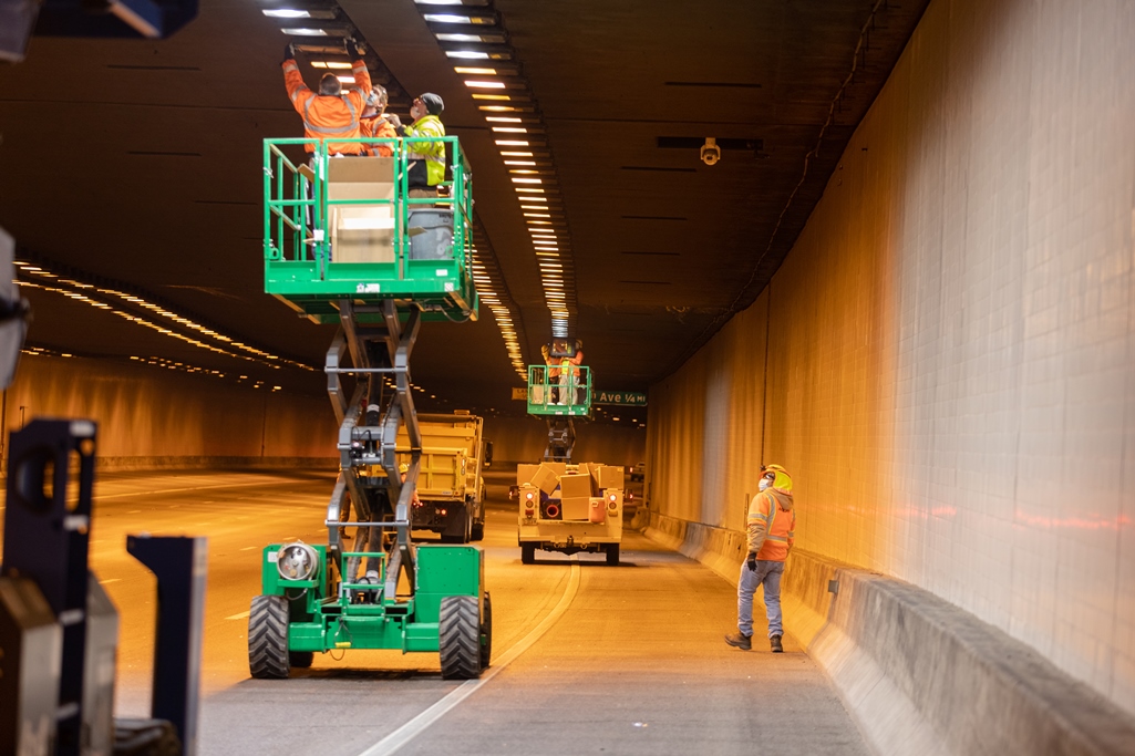 Crew on lift adds new lights in Deck Park Tunnel