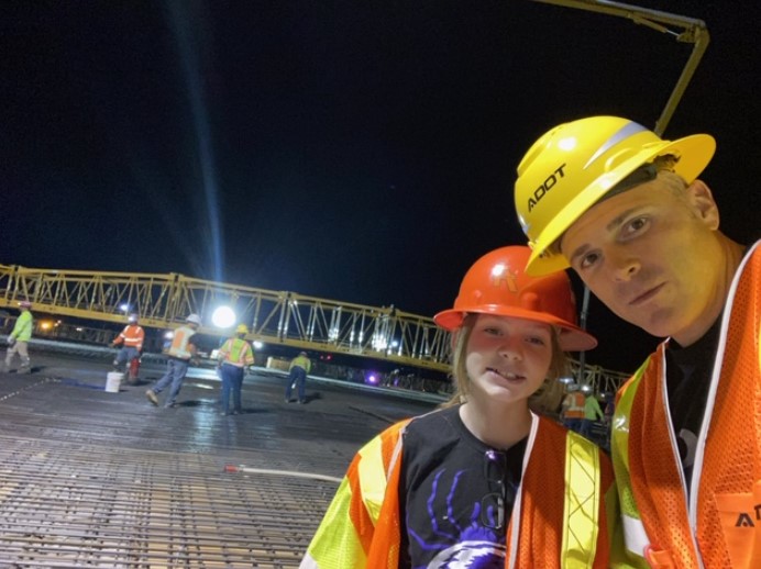 Engineer Jeremy Moore and his daughter at bridge deck pour