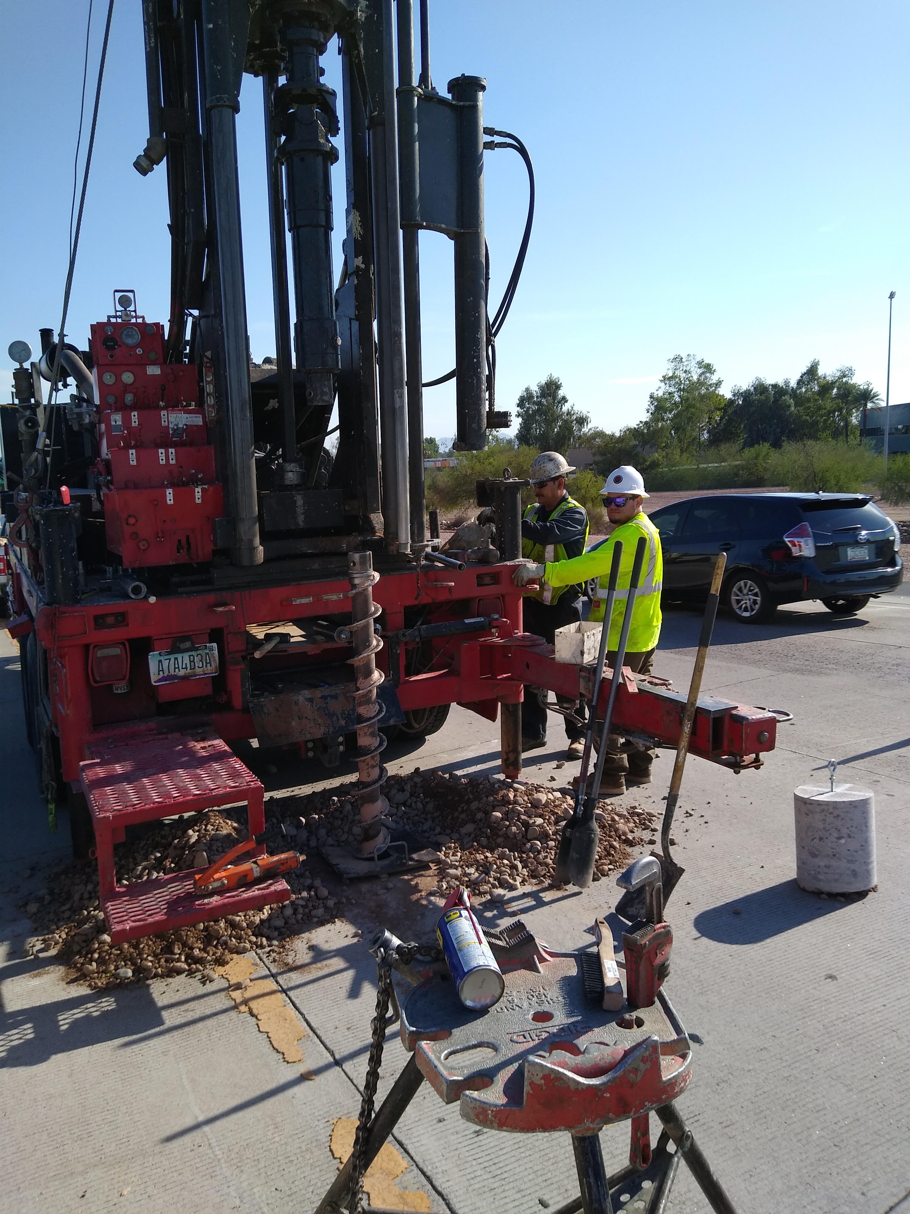 Workers operate large drill