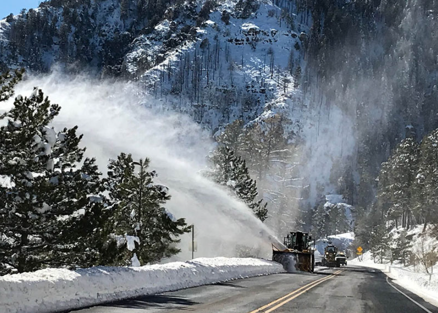 ADOT snow blower clears highway