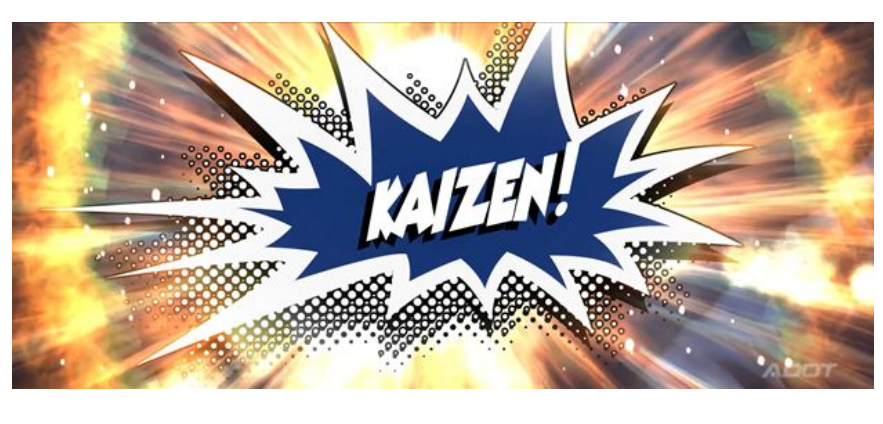 Comic-style explosion graphic with the word KAIZEN! in bold white letters on a blue background, surrounded by bright, radiating lines and dots.