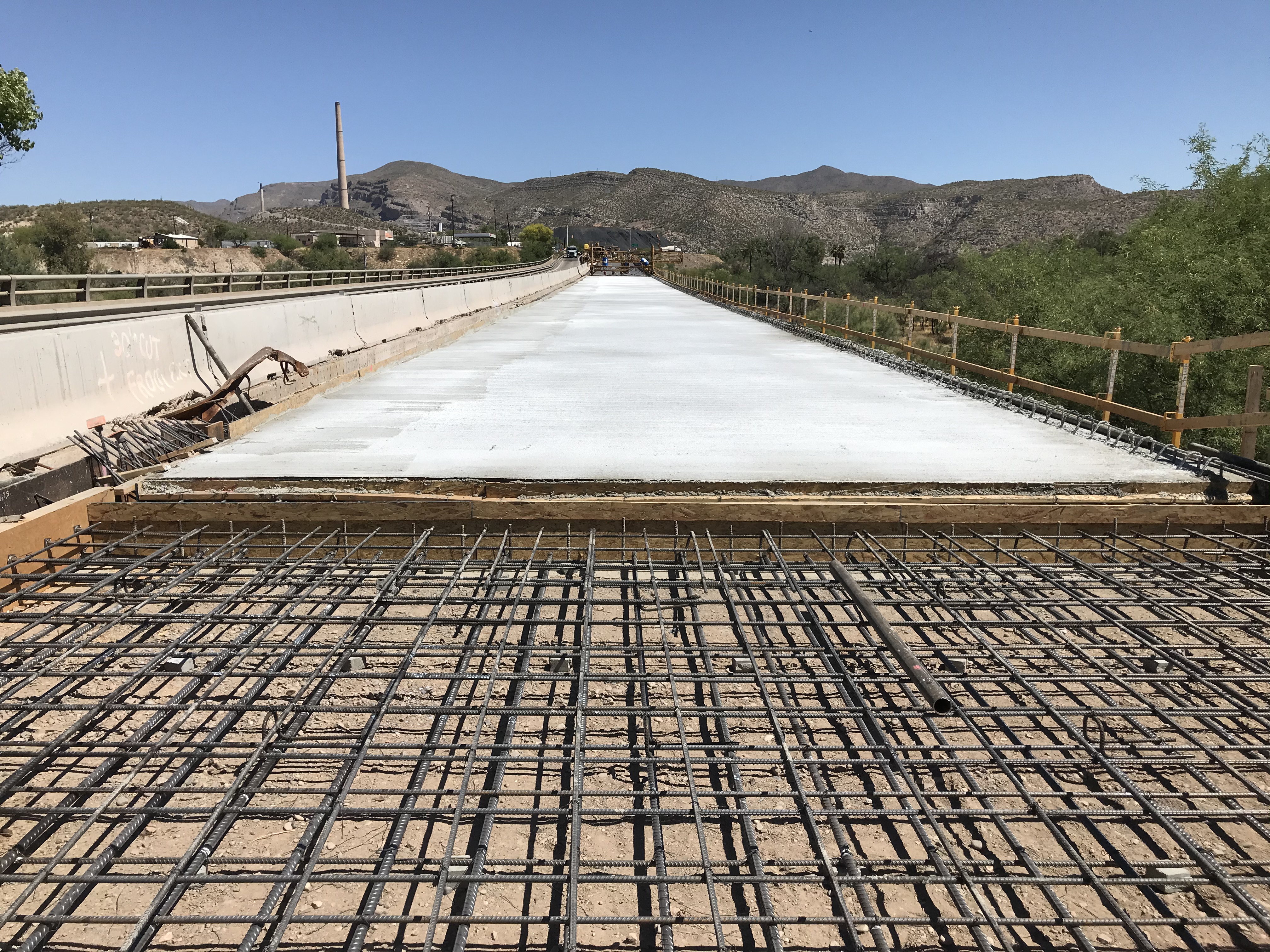 New concrete lies next to rebar set for next pour