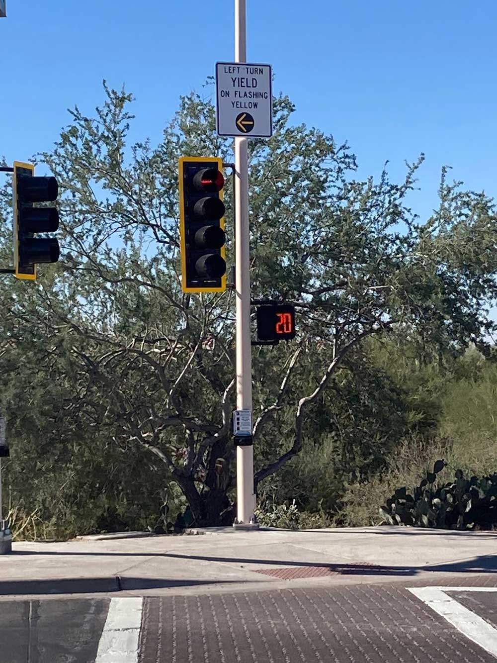 Dove Mountain Blvd. Intersection new traffic signal on Dove Mountain Boulevard. Blue sky and desert vegetation in Marana.