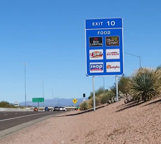 Logo sign next to freeway