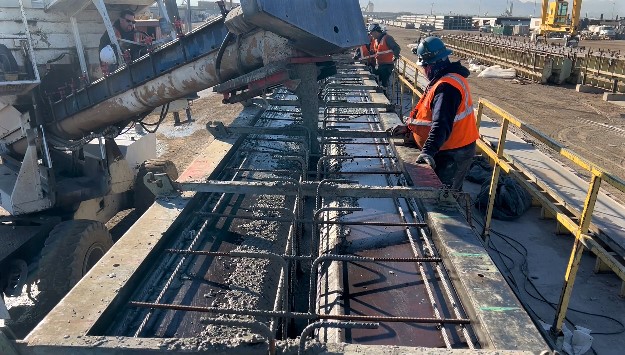 Pouring concrete to create a girder