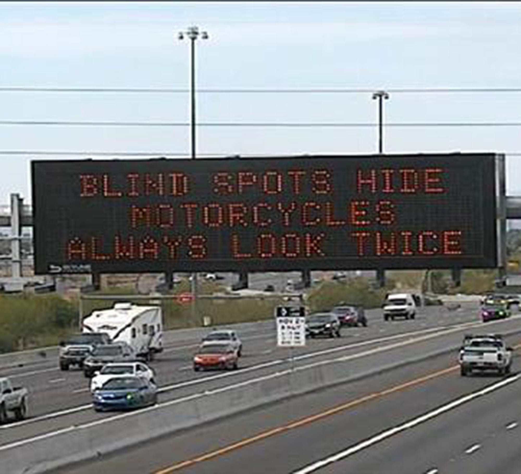 Freeway board with motorcycle safety message