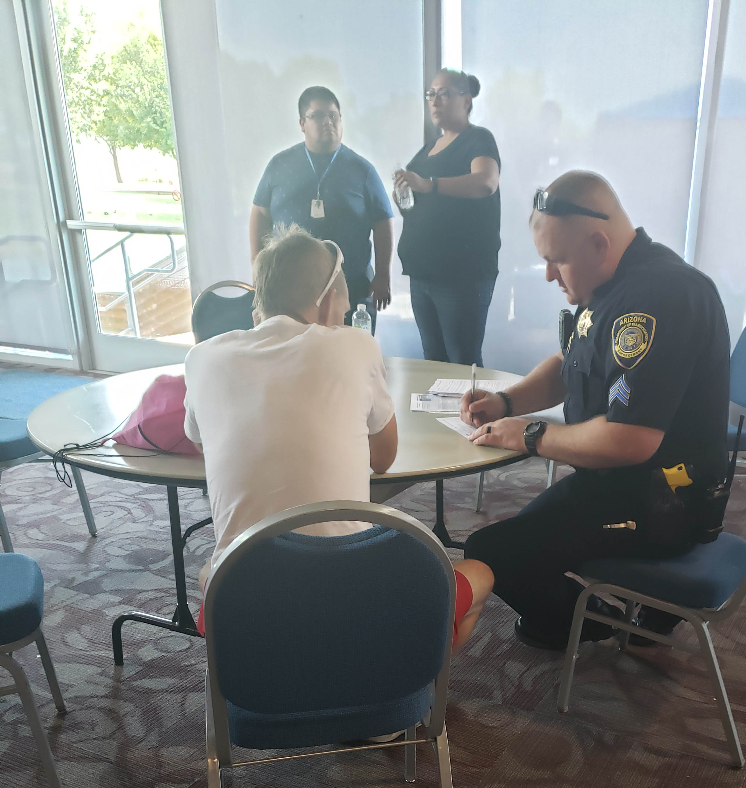 ADOT officer assists individual at event