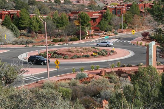Vehicles negotiate a roundabout