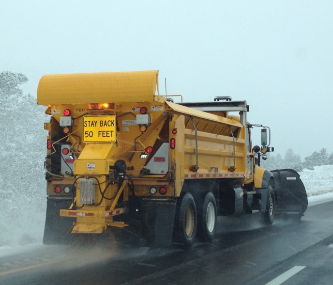 Snowplow clearing highway