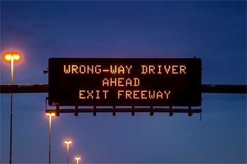 Wrong way driver warning on message board