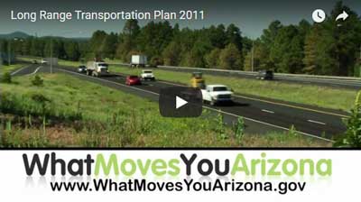 Several vehicles travel on a divided highway bordered by trees, with a banner at the bottom reading What Moves You Arizona and a website URL.