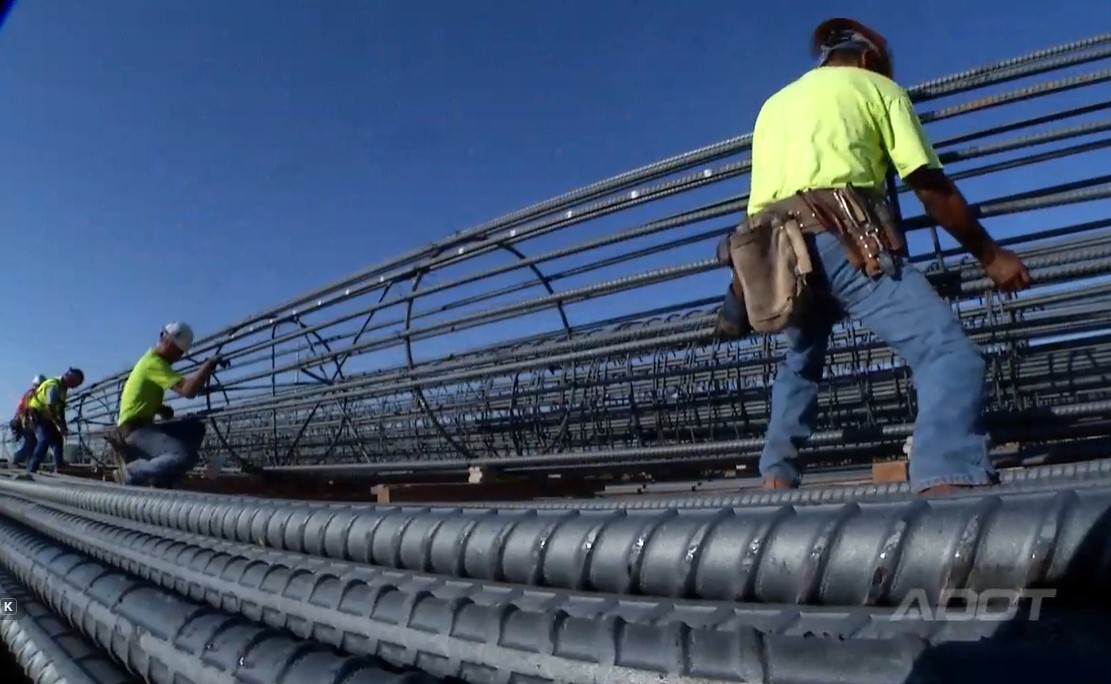 Workers with a rebar cage