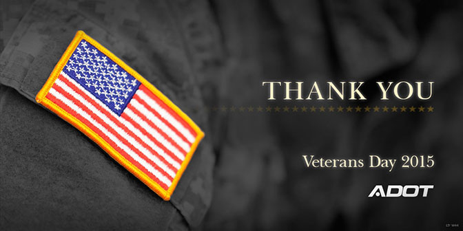A U.S. flag patch on a uniform with the words Thank You and Veterans Day 2015 next to the ADOT logo on a dark background.