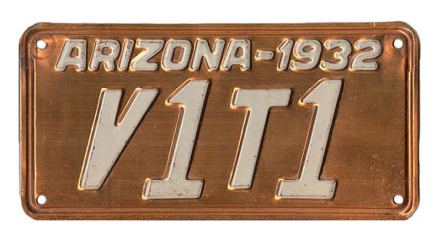 Arizona 1932 license plate with the number V1T1 in white letters on a copper background.