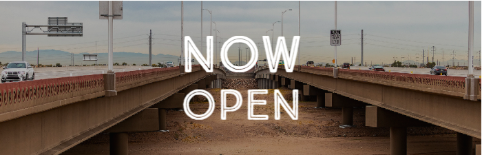 View of South Mountain Freeway with words Now Open over it