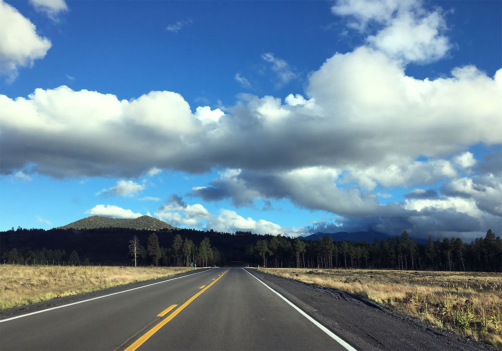 US 180 with forest and mountains in the background