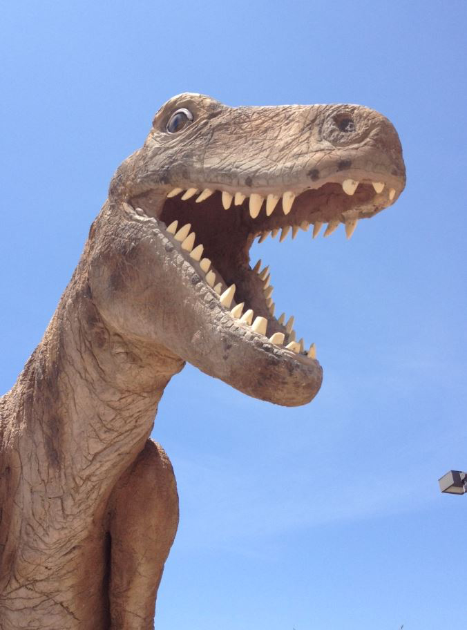 Dinosaur with mouth open showing teeth