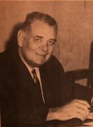 Justin Herman at a desk