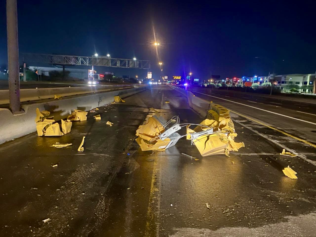 Crash debris on freeway of vehicle into attenuator