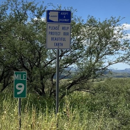 Volunteer sign please help protect our beautiful earth at mile 9