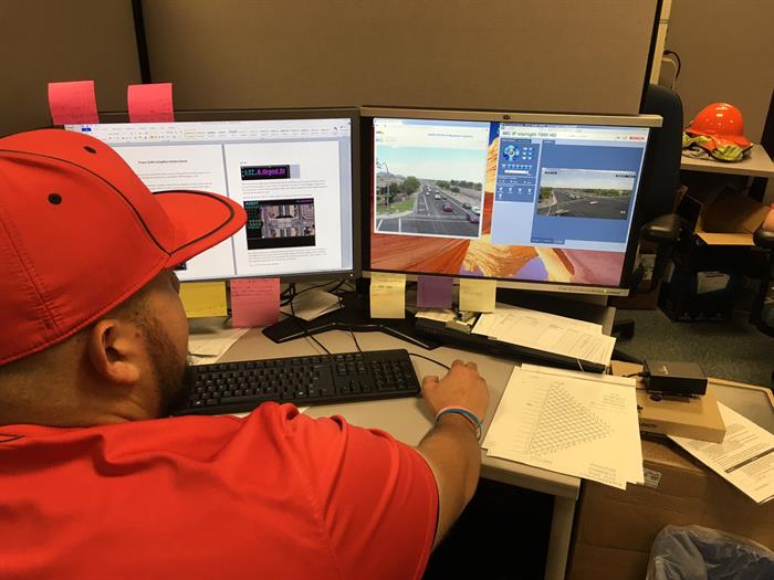 Operator monitors traffic signals remotely via computer