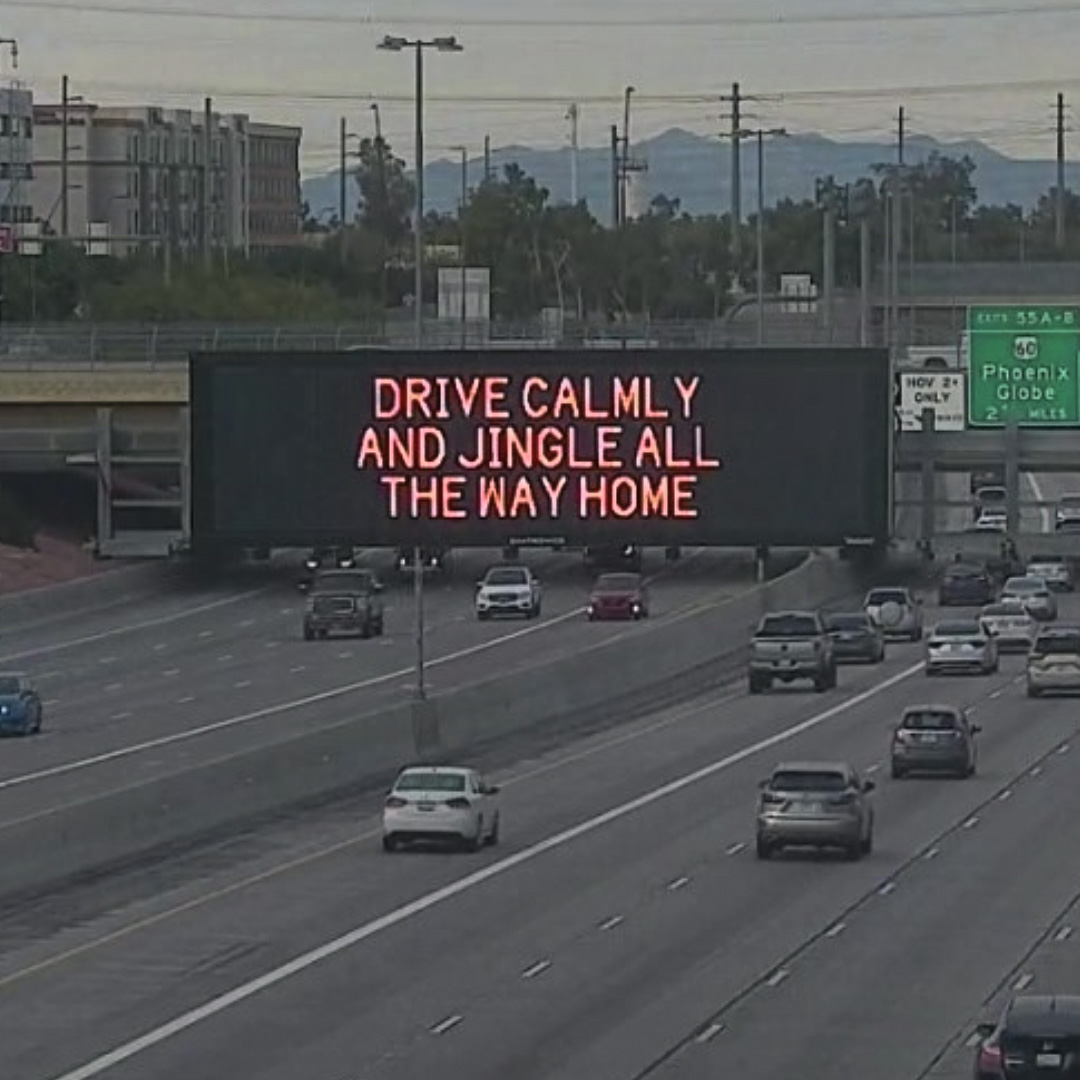 A digital message board on the highway encourages motorists to drive calmly.