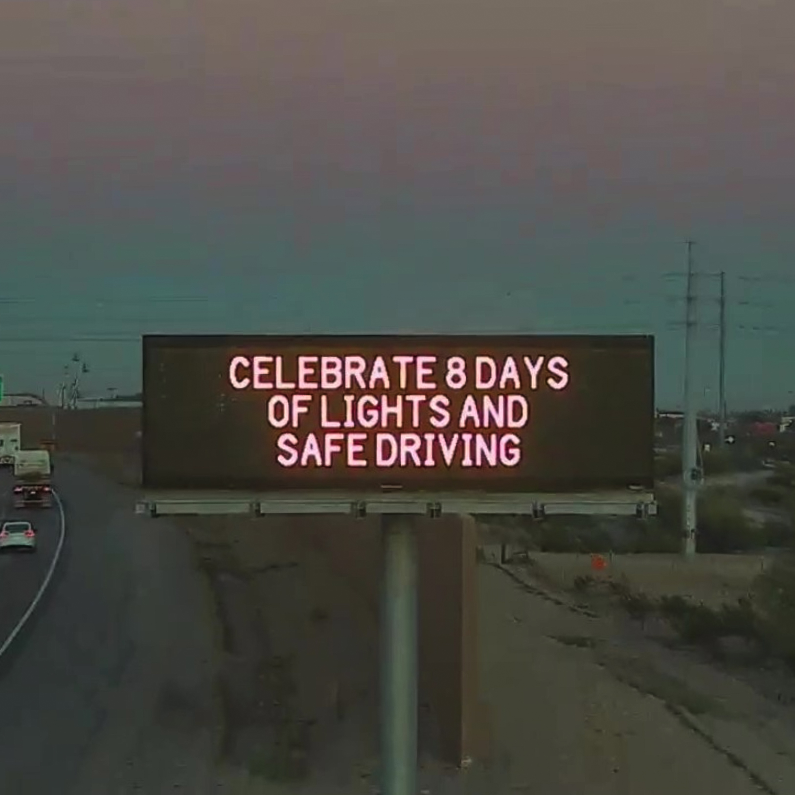 A digital message board on the highway encourages motorists to drive safe.