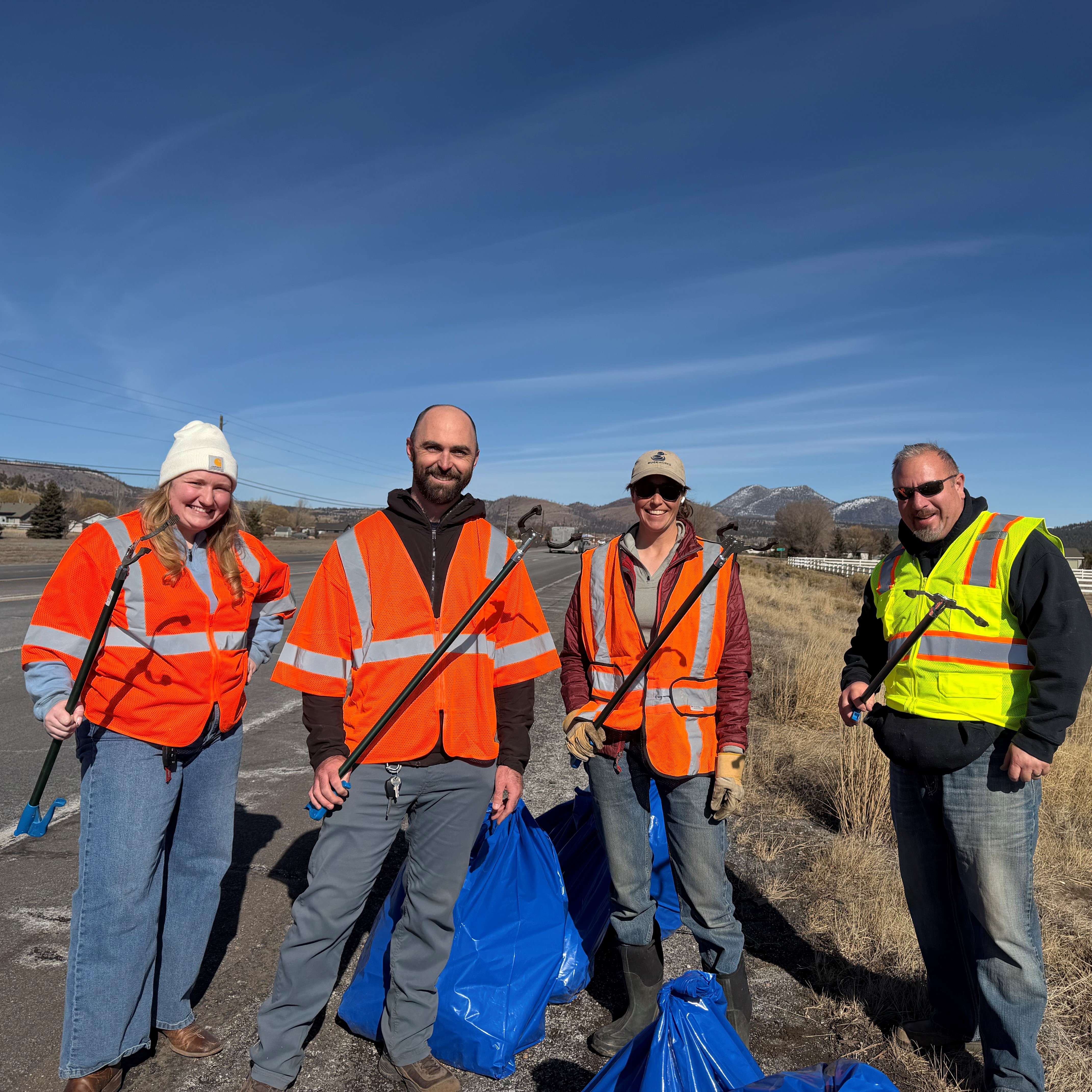 Four volunteers cleaning US 89