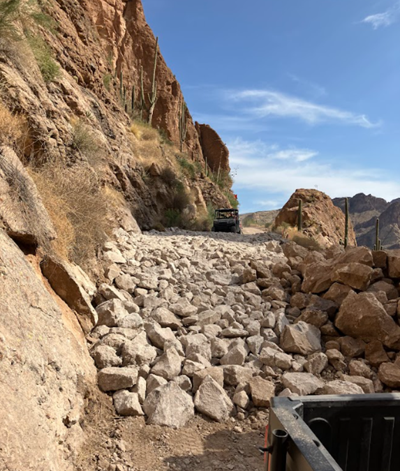 Rock slope stabilization work along a steep canyon wall on SR 88.