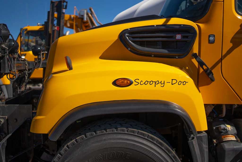 side view of snow plow with Scoopy-Doo stenciled above the wheel