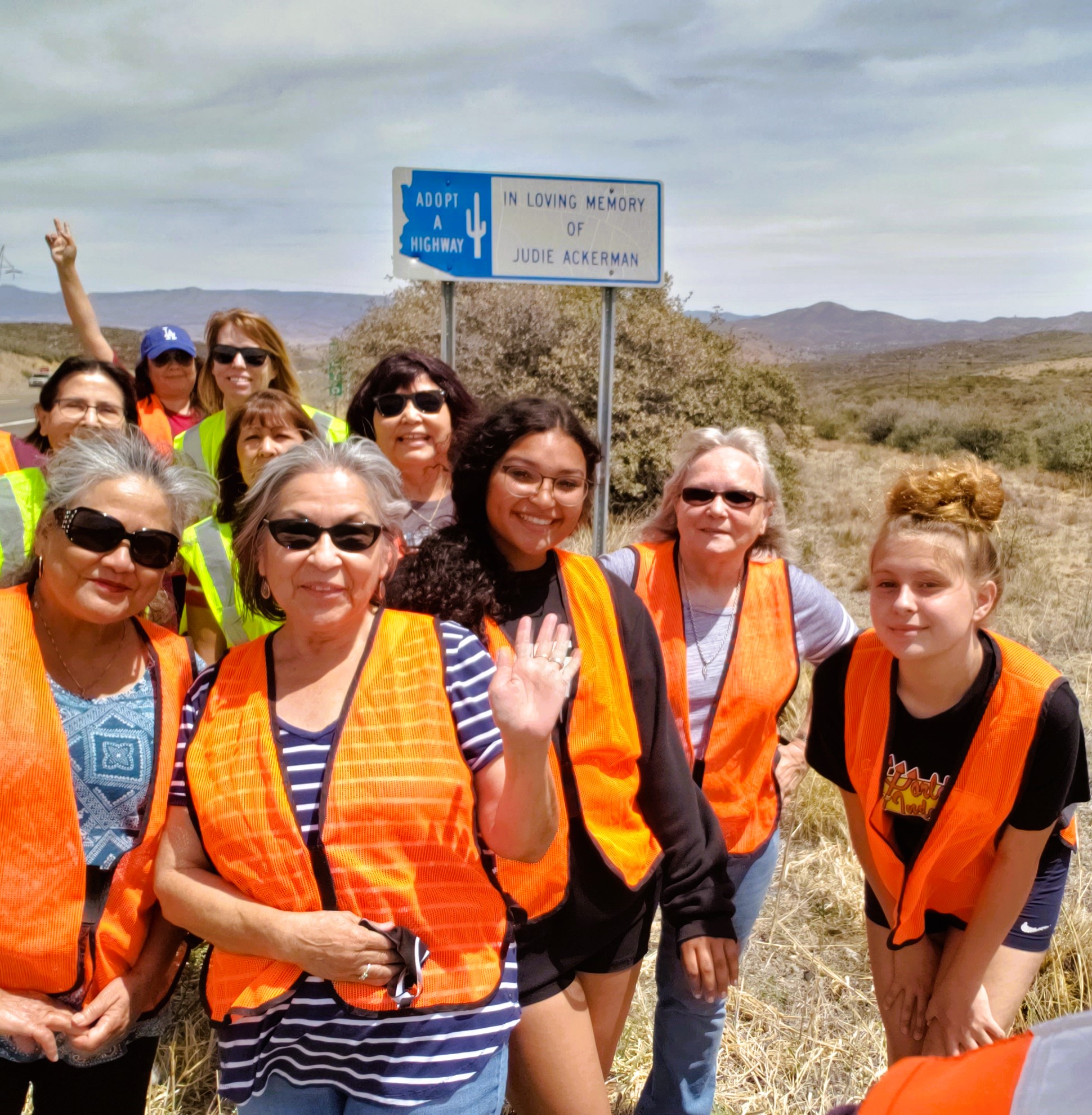 Volunteers with Adopt a Highway sign for Judi Ackerman on SR 69