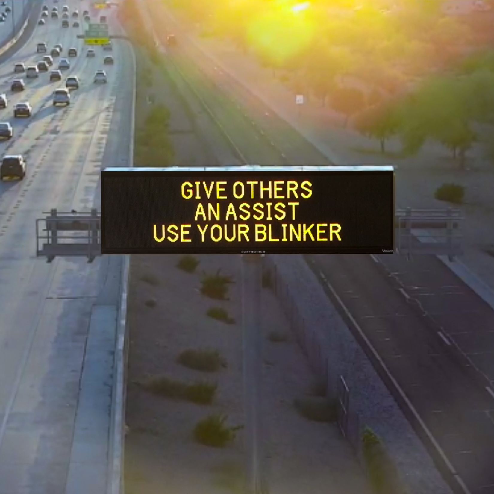 A digital message board on the highway encourages motorists to use their blinker..