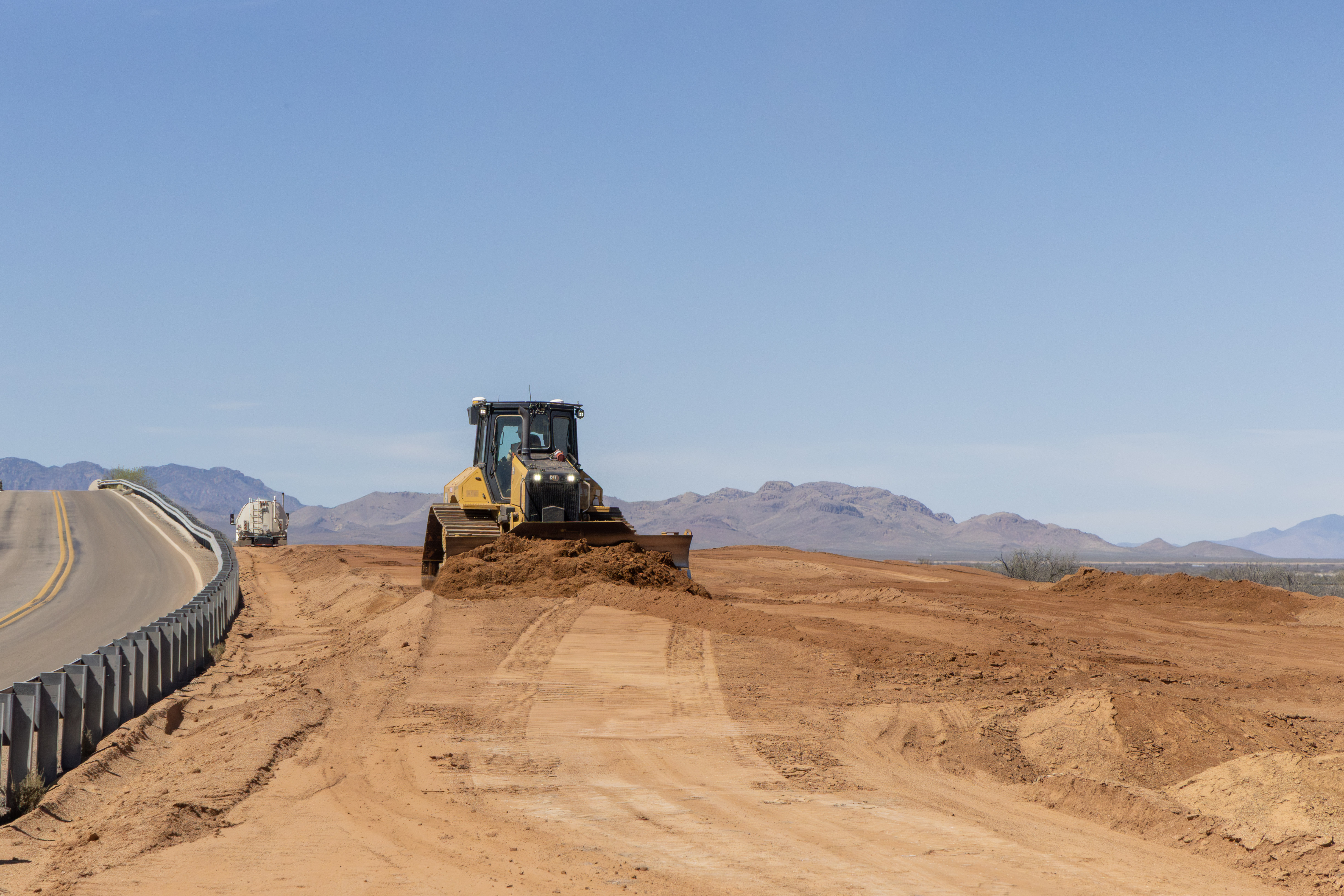 Bulldozer moving dirt for the new US 191 Cochise bridge replacement project