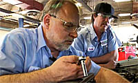 Director of ADOT learning Maintenance of a vehicle