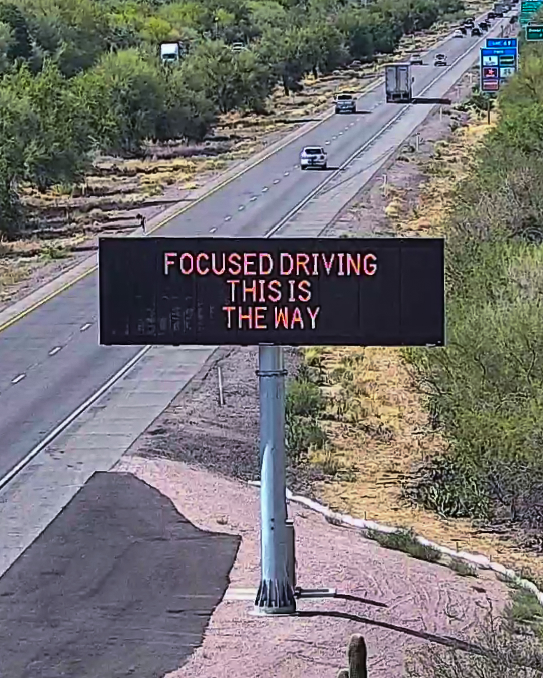 A digital message board on the highway encourages motorists to drive focused.