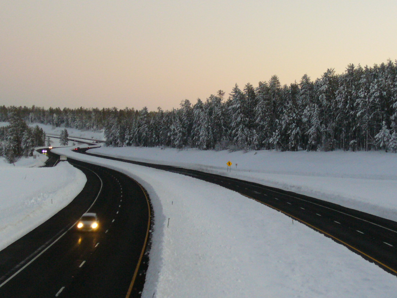 Snow on I-17 at twilight
