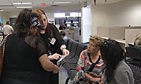 MVD customers and staff in an MVD office