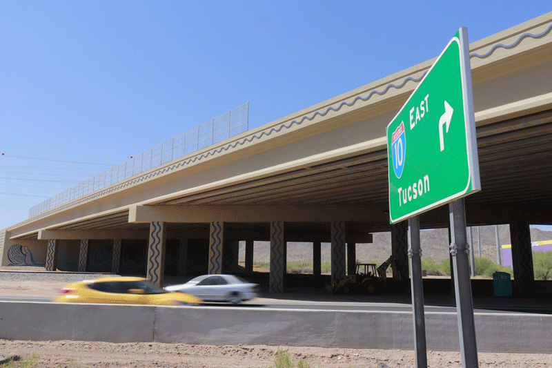 I-10 at Jimmie Kerr Blvd. overpass, car and green sign