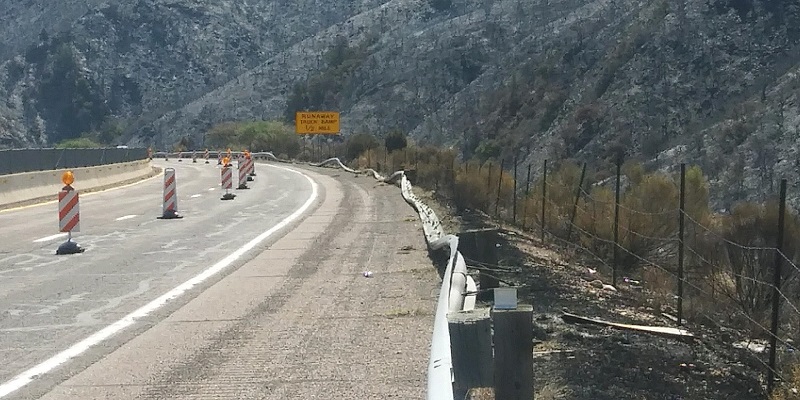 File photo of aftermath of brush fire along a state highway