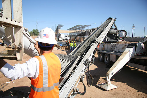 Worker running construction equipment on Loop 303
