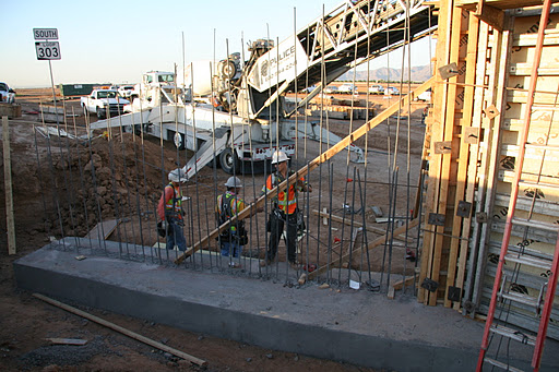  Crews building an underpass for construction vehicles to use during construction.