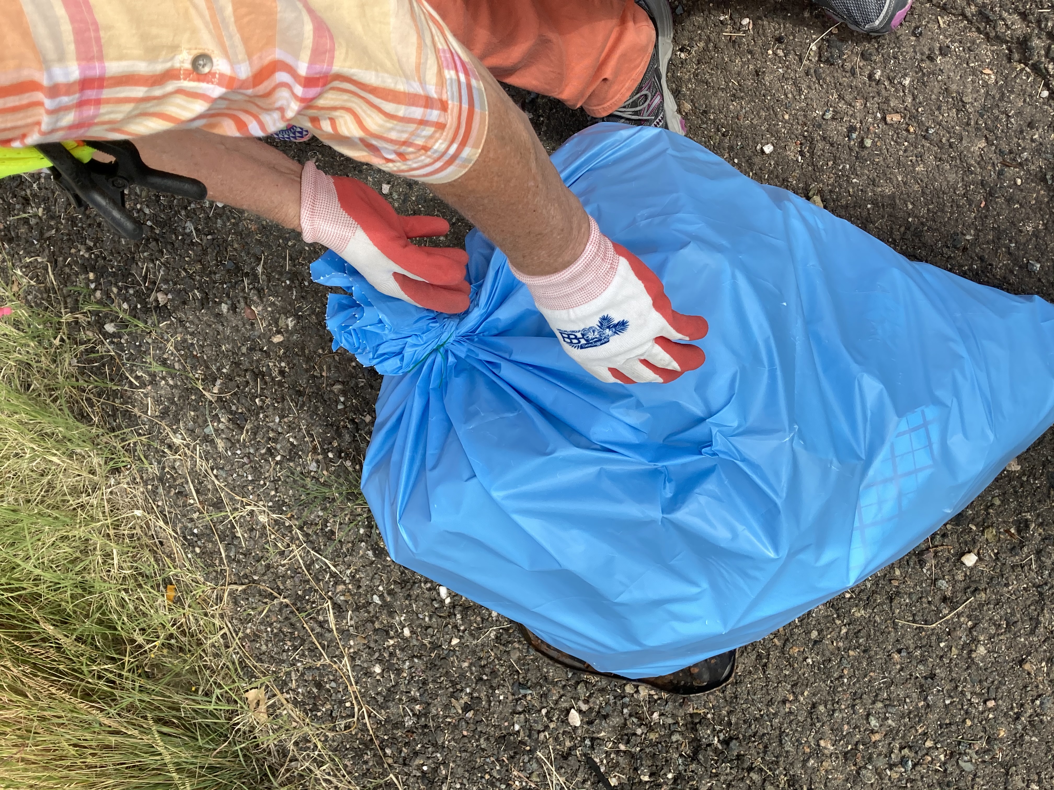 Adopt a Highway volunteer picks up trash