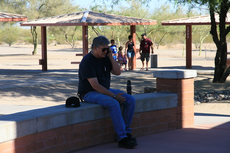 Man on phone at rest area