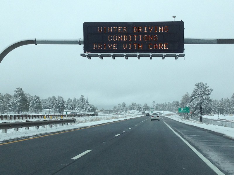 Photo of overhead message board with winter travel warning