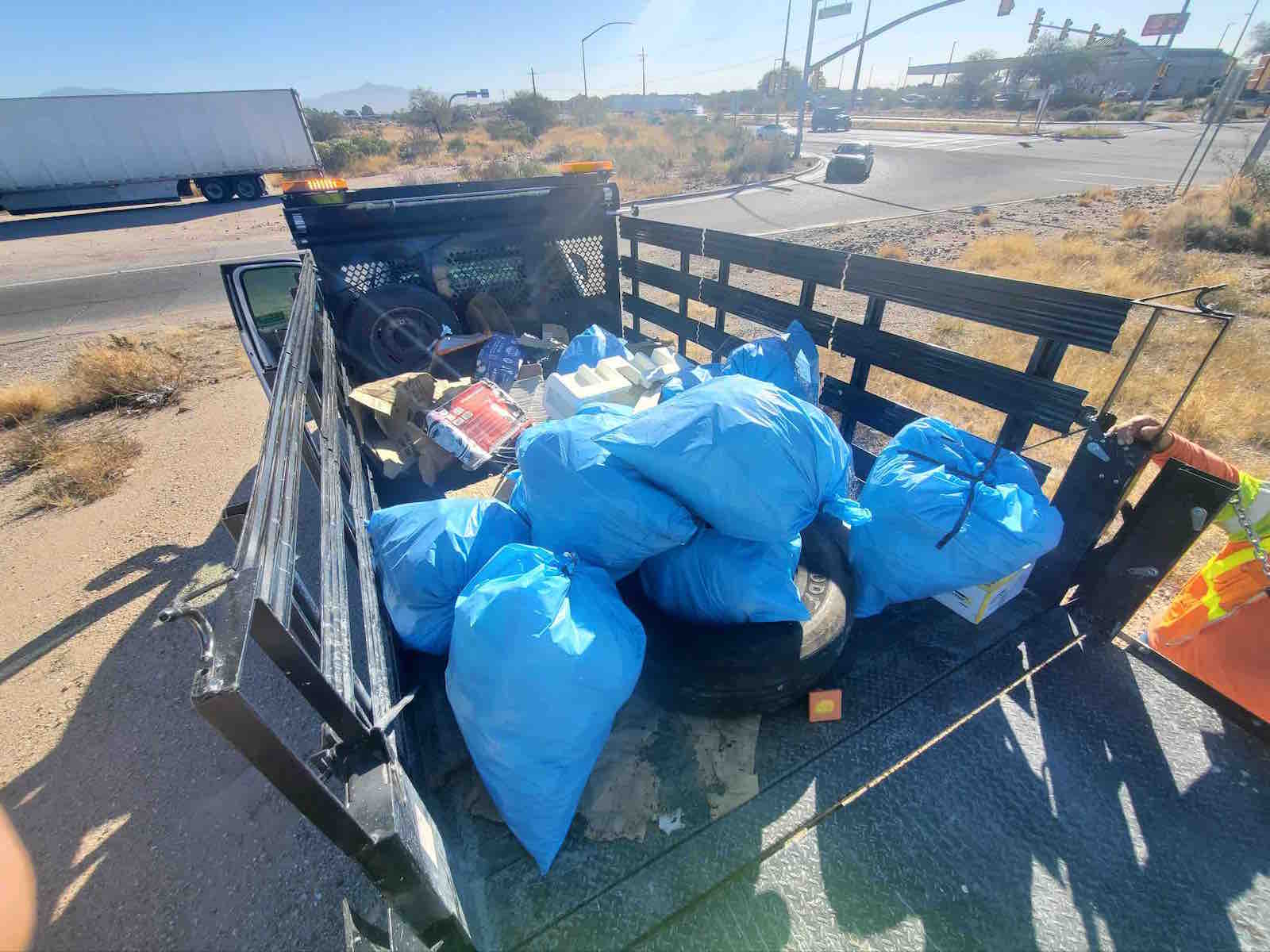 Bags of trash in a truck following the Tucson-area litter cleanup